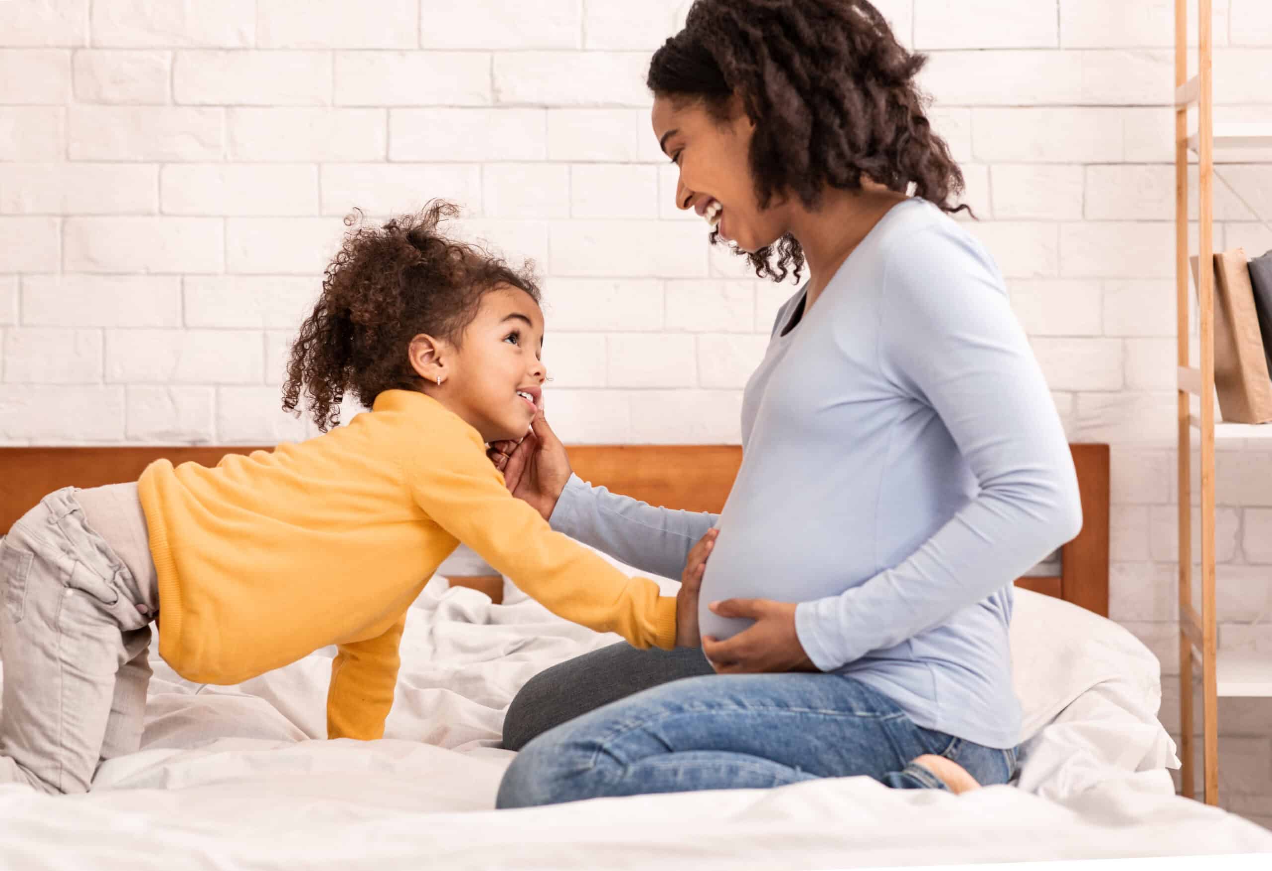 Mama Linc Mother Pregnant with Second Baby and Toddler Rubbing Belly